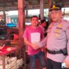 Kasat Binmas Polres Agam Ajak Warga Pasar Bawan Jaga Kekompakan dan Keamanan